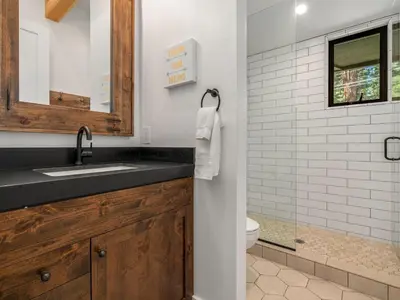 a bathroom with a sink and a toilet at Modern Millcreek Home in Incline Village