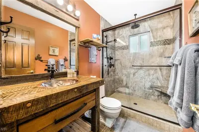 a bathroom with a sink and a shower at 1331 Zurich Lane - Modern Mountain Chalet in Incline Village