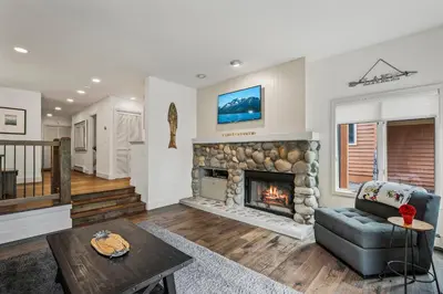 a living room with a fireplace and a couch at 153 McCloud The perfect location! Enjoy the sun drenched deck in Incline Village
