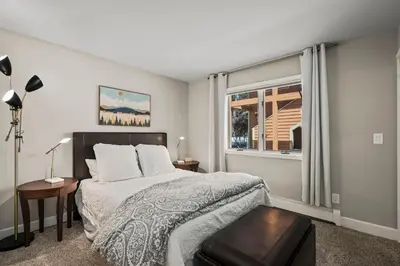 a bedroom with a large bed and a window at 147 McCloud - The Perfect McCloud Getaway in Incline Village