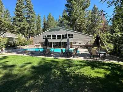 a house with a swimming pool in the yard at 168 Forest Pines - walk to Lakeshore Blvd community pool and hot tub in Incline Village