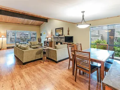 a living room with a table and a dining room at 168 Forest Pines - walk to Lakeshore Blvd community pool and hot tub in Incline Village