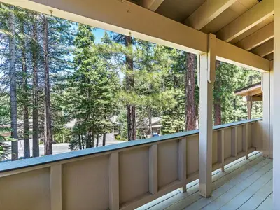 a screened porch with a view of the trees at Mountain Shadows #172 - - pool in Incline Village