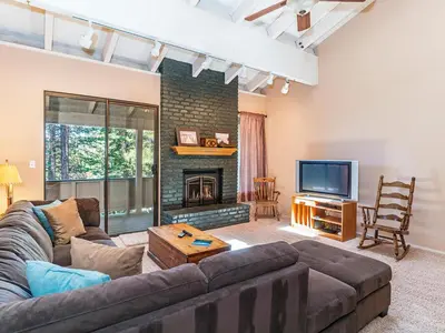 a living room with a couch and a fireplace at Mountain Shadows #172 - - pool in Incline Village