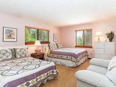 a bedroom with two beds and a couch at A great mountain home offering amenities that makes for a great getaway in Lake Tahoe in Incline Village