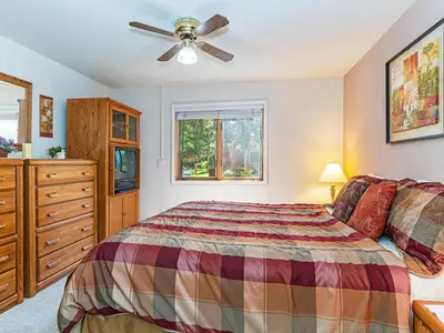a bedroom with a bed and a ceiling fan at The McCloud Condominium complex is one of the most popular vacation rentals in Incline Village