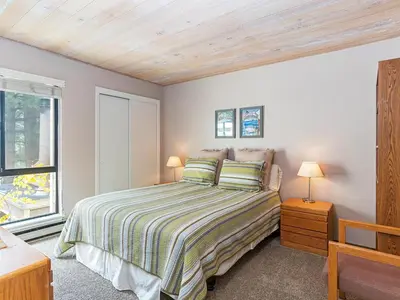 a bedroom with a bed and a window at 214 Forest Pines Nicely Decorated 4 Bedroom Condo in Incline Village