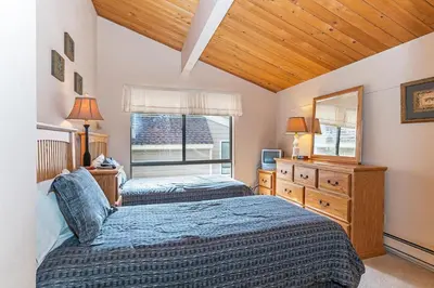 a bedroom with two beds and a window at Forest Pines Condo #216 in Incline Village