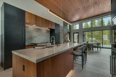 a kitchen with a large island with a counter top at Elegance at Schaffer's Mill - Luxury 4 BR, Private Hot Tub, Pet Friendly! in Truckee