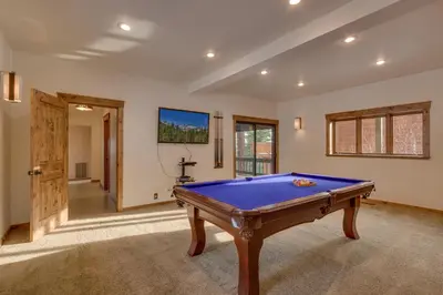 a room with a pool table in it at Kings Way Lake View by Tahoe Getaways - Spacious 4 BR w Private Hot Tub, Pool Table! in Tahoe Vista