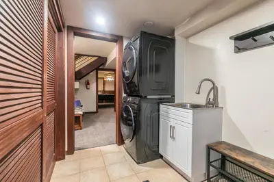 a laundry room with a washer and dryer and a sink at Lake of the Sky at Dollar Point - Stunning 4BR,4BA w Lake Views, Hot Tub and Pet-friendly in Tahoe City