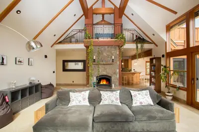 a living room with a couch and a fireplace at Look Out Lodge - On North Shore w Lake View, Hot Tub, Pool Table and Pet Friendly in Kings Beach