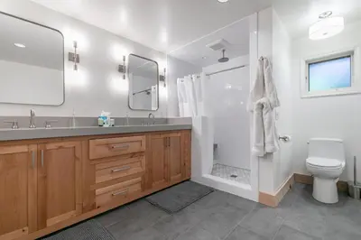 a bathroom with a shower and a sink and a toilet at Lupine Lodge at Tahoe Park on the West Shore - Hot Tub, Beach Access, Near Ski Resorts! in Tahoe City