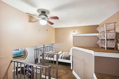 a living room with a ceiling fan and a bedroom at On the Edge at Alpine Meadows - Fireplace- Mountain Views- Great Location! Shuttle Service! in Olympic Valley