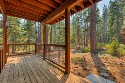 a porch with a view of a forest at Paradise in the Pines - Luxury Home in Quite Neighborhood, Wooded Views, Short Drive to Skiing in Carnelian Bay
