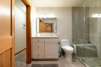 a bathroom with a toilet and a sink and a shower at Shady Pines at Tahoe Donner- Serene Forest Retreat, 2 Gas Fireplaces, Sauna in Truckee
