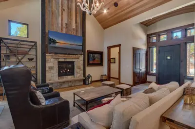a living room with a couch and a fireplace at Sage Hen at Grays Crossing - Gorgeous 4BR 4BA Home w Private Hot Tub in Truckee