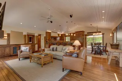 a living room with a couch and a table at Hawk's Peak at Tahoe Donner in Truckee