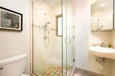 a bathroom with a shower and a toilet and a sink at North Shore Bliss by Tahoe Getaways - 3 BR plus loft & Private Hot Tub in Carnelian Bay