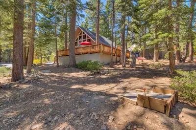 a house in the middle of a forest at Piney wood - Quiet 2 BR Loft w Private Hot Tub in Carnelian Bay