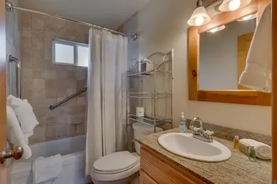 a bathroom with a sink and a toilet and a shower at Piney wood - Quiet 2 BR Loft w Private Hot Tub in Carnelian Bay