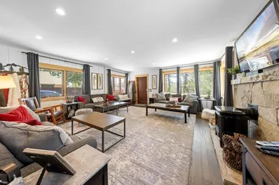 a living room filled with furniture and a fireplace at Rustling Grove in Tahoe City - Pet-Friendly, Walking Distance to Downtown and Lake - Private Hot Tub in Tahoe City