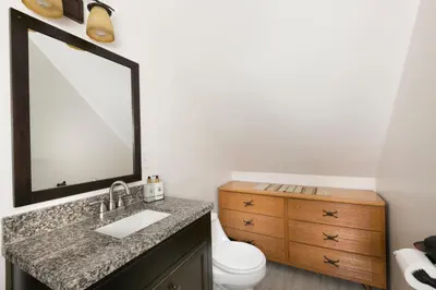 a bathroom with a sink and a mirror at Pineland Chalet in Tahoe City - Classic Cabin Wood Fireplace Dog Friendly in Tahoe City