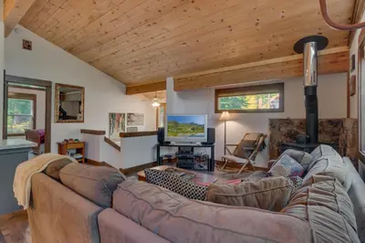 a living room with a couch and a tv at Silver Tip at Tahoe Park w HOA amenities - 3BR Pet Friendly, Hot Tub, Tahoe City in Tahoe City