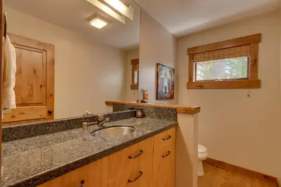 a bathroom with a sink and a toilet at Tahoe Point of View - Amazing Lake Views at this 4BR w Hot Tub, Sauna, Near Skiing in Tahoe City