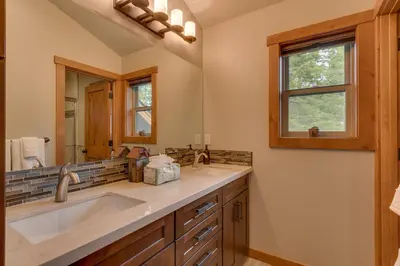 a bathroom with a sink and a mirror at Skyland Jewel at Dollar Point - Luxury 3BR - Easy Winter Access in Tahoe City