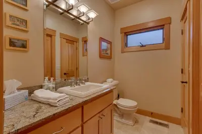 a bathroom with a sink and a toilet at Tahoe Time on North Shore - 4 BR Cabin w Private Hot Tub, Pet Friendly, Walk to Dining in Tahoe Vista