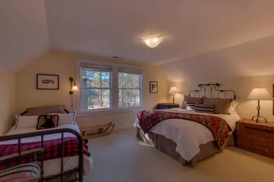 a bedroom with two beds and a window at Vanni House - Classic Tahoe Style 2 BR - Sleeps 6 - Hot Tub - Near Palisades & Downtown Tahoe City in Tahoe City