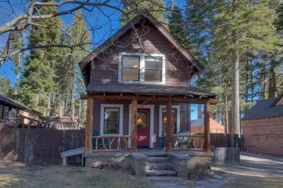 a tiny house in the woods with a porch at Vanni House - Classic Tahoe Style 2 BR - Sleeps 6 - Hot Tub - Near Palisades & Downtown Tahoe City in Tahoe City