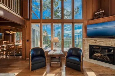 a living room with a fireplace and a tv at View at Dollar Point - Beautiful Lake Views with Sunny Deck, Quiet Neighborhood, Near Skiing in Tahoe City
