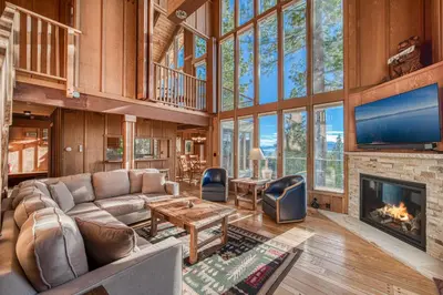 a living room with a couch and a fireplace at View at Dollar Point - Beautiful Lake Views with Sunny Deck, Quiet Neighborhood, Near Skiing in Tahoe City