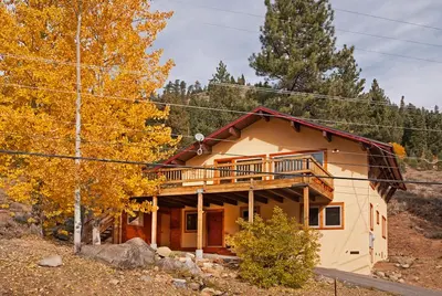 a house with a balcony on the side of it at Valley View at Palisades -4 BR w Mountain Views, Pet-Friendly, and Close to Village in Olympic Valley