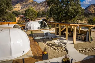 a large white dome tent with mountains in the background at Sequoia Studio Suites in Three Rivers