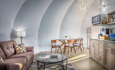 a living room with a couch and a table at Sequoia Studio Suites in Three Rivers
