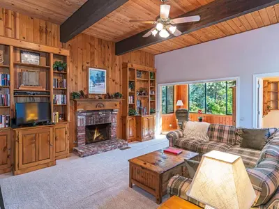 a living room with a couch and a fireplace at 223 Forest Pines short walk to bike path and the Hyatt Casino in Incline Village