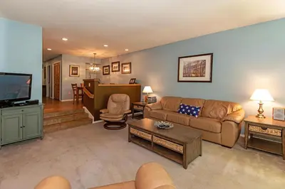 a living room with a couch and a tv at 226 McCloud great location in Incline Village