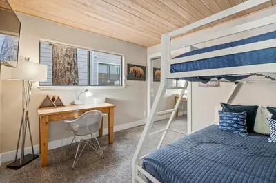 a bedroom with a bunk bed and a desk at The perfect Forest Pines getaway in Incline Village
