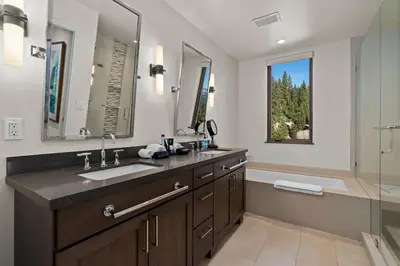 a bathroom with a sink and a mirror and a shower at Appreciate this exclusive private penthouse located on Lake Tahoe in Crystal Bay