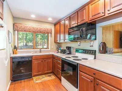 a kitchen with wooden cabinets and a stove top oven at 39 McCloud Incline Village in Incline Village