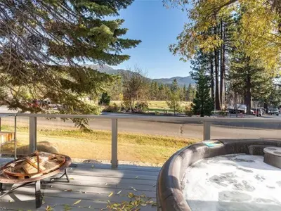 a hot tub and a table on a porch at Incline Village Championship Golf Coarse Retreat in Incline Village