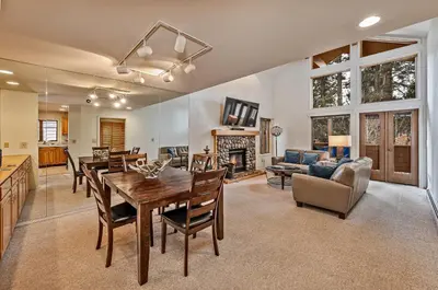 a kitchen and living room with a table and chairs at 5 McCloud - Bright and Quaint Living in Incline Village