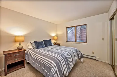 a bedroom with a bed and a window at 5 McCloud - Bright and Quaint Living in Incline Village