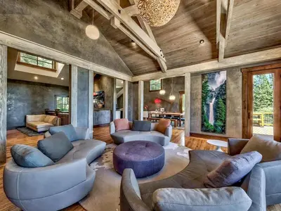 a large living room with couches and a table at A Touch Of Tuscany In a Lake Tahoe Estate in Incline Village