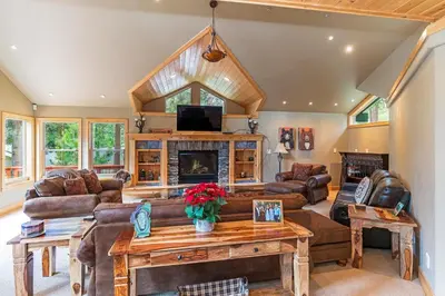 a living room with leather furniture and a fireplace at 585 Knotty Pine - Gorgoeous Moutain Home in Incline Village