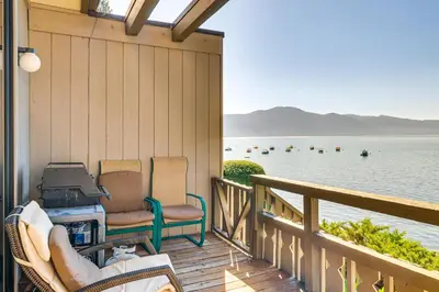 a porch with chairs and a view of the water at Lake Tahoe Gem with Furnished Deck and Water Views! in Incline Village