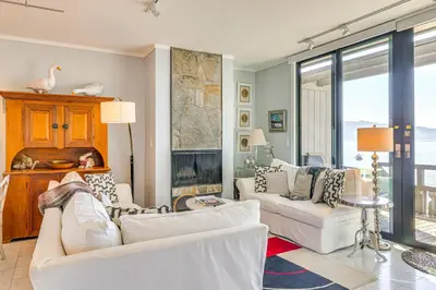 a living room with two white couches and a fireplace at Lake Tahoe Gem with Furnished Deck and Water Views! in Incline Village